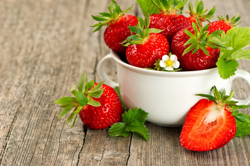 Strawberries with leaves and flowers