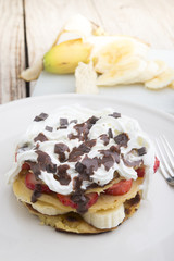 pancakes with strawberries, banana, blueberries and chocolate...
