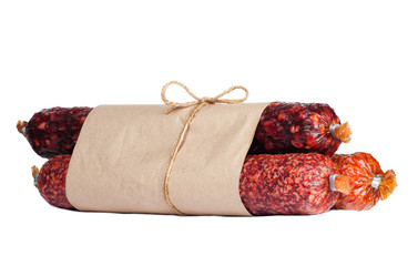 Three salami wrapped in packaging solated