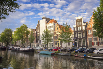 Fototapeta na wymiar Amsterdam traditional houses facing on a canal 