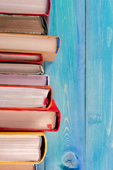 Composition with old vintage colorful hardback books, diary on w