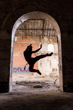 Men Training Kickboxing in Abandoned Place