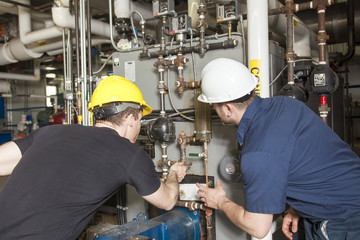 repairman engineer or inspector who check the system.