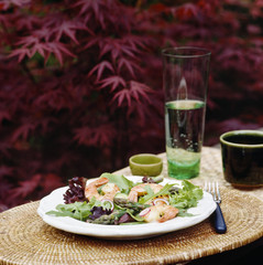 Salad with shrimp and asparagus outdoors
