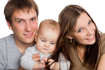 Little son and his happy parents