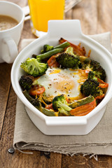 Baked vegetables with an egg on top