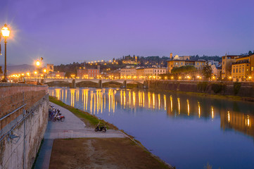 Fototapeta na wymiar Florence, Tuscany (Italy) at night, a bridge over the river Arno