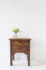 brown wood table in white room.