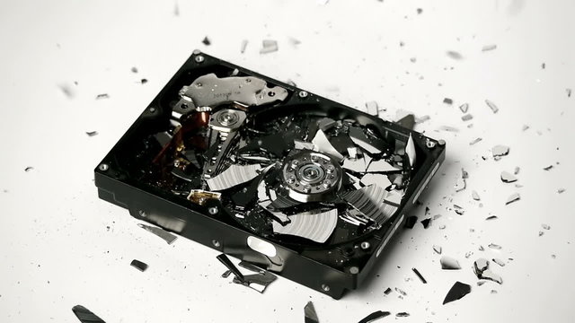 Hard Disk Hammered and Destroyed into Shards By a Hammer in Slow Motion 60p to 24p