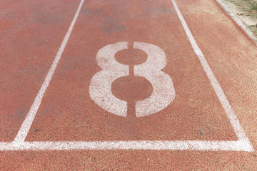 Start track. Lanes 8, number eight of a red racing track.