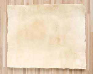 Vintage paper texture on wood background.