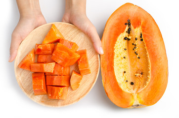 Piece and half of ripe papaya fruit on white background