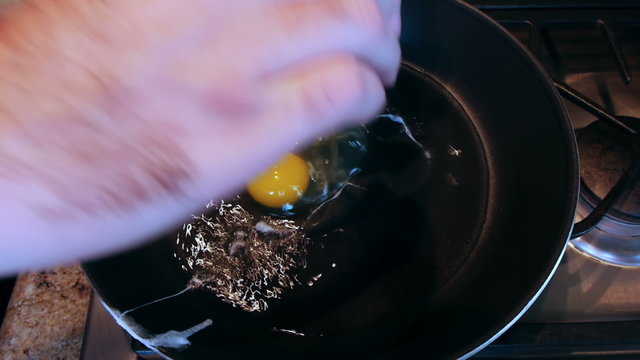 Single Egg Shell With Two Yolks Cooked on Pan