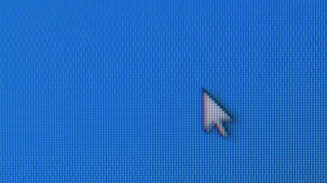 Close-up of mouse pointer on the desktop