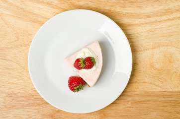 Homemade strawberry cheesecake  on white plate