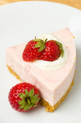 Homemade strawberry cheesecake  on white plate