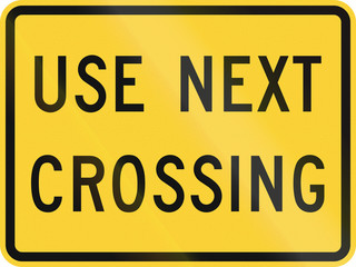 Fototapeta premium United States MUTCD road sign - Use next crossing