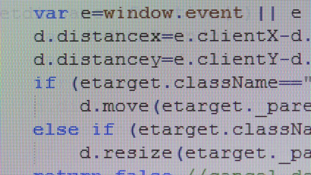 Close-up of computer code running on desktop pc monitor