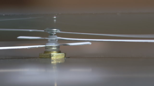 Close-up of vintage mechanical clock running