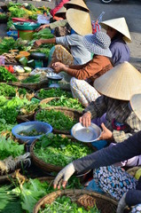 Seller on the colour market in Vietnam