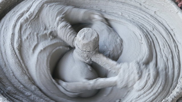 rotating cement concrete mixer in machine