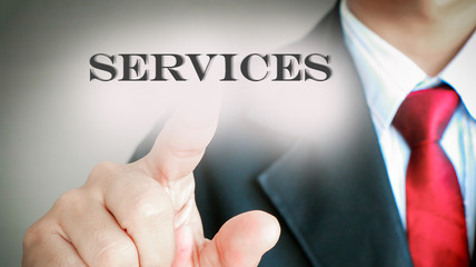 Businessman with red tie showing press on text 