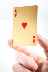 Golden ace in a hand