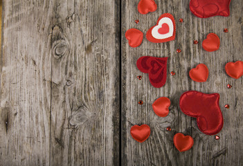 Hearts on a wooden background.