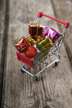 Shopping cart with gifts and heart