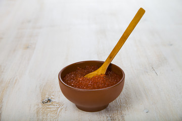 Red caviar in the brown bowl