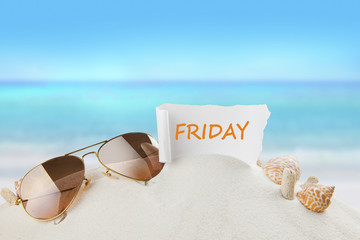 friday paper on beach,holiday concept