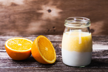 Obraz na płótnie Canvas Delicious orange smoothie in a glass jar