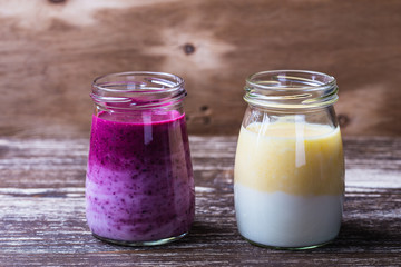 Delicious blueberry and orange smoothie in a glass jars