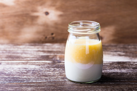 Delicious orange smoothie in a glass jar
