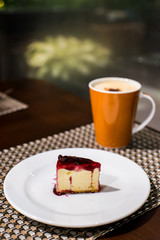 blueberry cheesecake with coffee