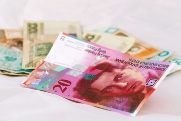 Obraz premium Swiss franc banknotes and Polish