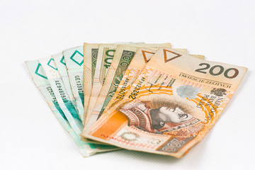 Polish banknotes on a white background