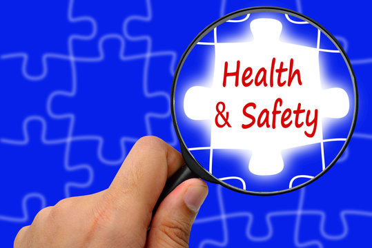 Health And Safety Word. Magnifier And Puzzles.