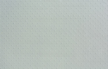 Gray wall of pimples