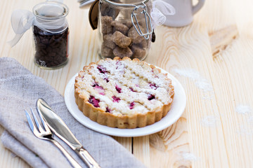 Homemade pie with coffee on a wooden background