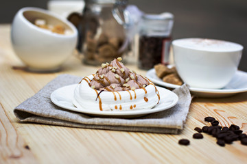 White meringues with brown chocolate stripes