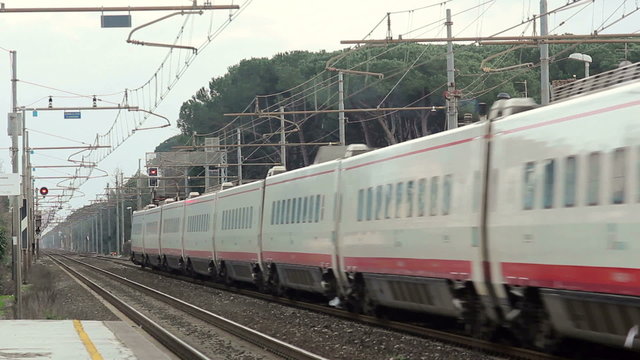 Passenger White and Red Fast Speed Electric Train is Passing from the Station.