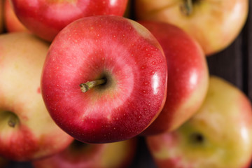 Apple on top of pile