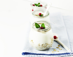 Healthy breakfast - yogurt with muesli and berries. Selective focus.