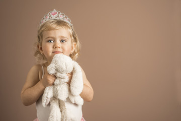  Baby girl with princess crown and stuffed toy © Maruba