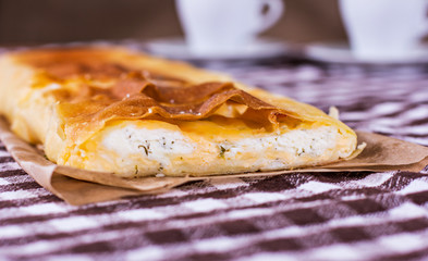 2 cups of coffee, a blanket, cake and heart