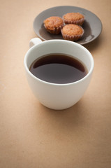 office desk with black coffee and banana cake.