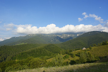 Obraz premium Evening and sunset on mountain hills of Simon village. Bran. RomaniaEvening and sunset on mountain hills of Simon village. Bran. Romania