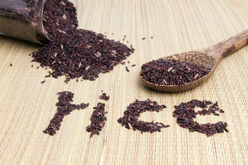 raw purple rice berry on mat