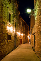 Plakat Mediterranean alley in a small town at night
